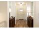 Inviting entryway with hardwood floors and dark wood console tables at 19777 E Ivy Ln, Queen Creek, AZ 85142