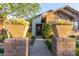 Close-up of the home's entryway showing brick pillars and walkway leading to the front door at 19777 E Ivy Ln, Queen Creek, AZ 85142