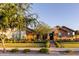 Charming single-story home with a well-manicured lawn, mature trees, and inviting curb appeal at 19777 E Ivy Ln, Queen Creek, AZ 85142