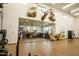 Large garage space with high ceilings, mounted animal decorations, and a work bench at 19777 E Ivy Ln, Queen Creek, AZ 85142