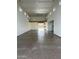 Large garage showcasing epoxy flooring, ample space, and natural light at 19777 E Ivy Ln, Queen Creek, AZ 85142