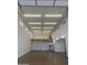 Spacious garage featuring ample lighting, and an epoxy floor at 19777 E Ivy Ln, Queen Creek, AZ 85142