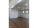 A spacious garage with a painted floor, white walls, and bright lighting at 19777 E Ivy Ln, Queen Creek, AZ 85142