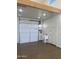 Garage interior featuring sink and well-maintained epoxy flooring at 19777 E Ivy Ln, Queen Creek, AZ 85142