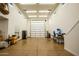 Expansive garage with high ceilings and recessed lighting provides ample storage and workspace at 19777 E Ivy Ln, Queen Creek, AZ 85142