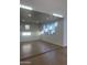 A well lit garage with a painted floor and multiple windows at 19777 E Ivy Ln, Queen Creek, AZ 85142