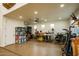 Spacious garage featuring epoxy floors, ample storage, and a ceiling fan at 19777 E Ivy Ln, Queen Creek, AZ 85142