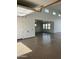 A spacious garage with a painted floor and multiple windows for natural light at 19777 E Ivy Ln, Queen Creek, AZ 85142