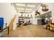 Spacious garage with high ceilings, epoxy floors, and ample storage and workout area at 19777 E Ivy Ln, Queen Creek, AZ 85142
