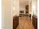 Hallway features hardwood floors and view into the spacious living room at 19777 E Ivy Ln, Queen Creek, AZ 85142