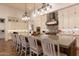 Bright kitchen showcasing a large center island with barstool seating and ample cabinetry at 19777 E Ivy Ln, Queen Creek, AZ 85142