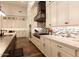 Modern kitchen with stainless steel appliances, stylish backsplash, and ample counter space at 19777 E Ivy Ln, Queen Creek, AZ 85142