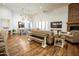 Spacious living room with stone fireplace and open access to the dining area at 19777 E Ivy Ln, Queen Creek, AZ 85142