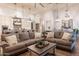 Bright open living space with a spacious sectional sofa and kitchen view at 19777 E Ivy Ln, Queen Creek, AZ 85142