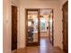 Bright office with custom built-ins, window seat, and stylish glass panel wooden door at 19777 E Ivy Ln, Queen Creek, AZ 85142