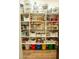 Walk-in pantry with organized shelving for ample food and storage containers at 19777 E Ivy Ln, Queen Creek, AZ 85142