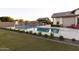 Large swimming pool with volleyball net, basketball hoop and seating area at 19777 E Ivy Ln, Queen Creek, AZ 85142