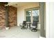 Cozy covered porch with seating, perfect for relaxing and enjoying the outdoors at 19777 E Ivy Ln, Queen Creek, AZ 85142