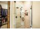 Walk in shower with tile surround, glass door and rainfall shower head at 19777 E Ivy Ln, Queen Creek, AZ 85142