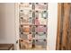 Organized storage closet featuring clear bins on shelves, perfect for decluttering and easy access at 19777 E Ivy Ln, Queen Creek, AZ 85142