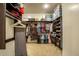 Large walk-in closet featuring custom shelves, hanging rods, and plenty of room for storage at 19777 E Ivy Ln, Queen Creek, AZ 85142