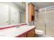 Main bathroom featuring a sink vanity, toilet, and shower/tub combo with glass doors at 2400 E Baseline Ave # 278, Apache Junction, AZ 85119