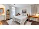 Bright bedroom with white walls, wood floors, and large window that offers natural light at 2402 E 5Th St # 1742, Tempe, AZ 85288