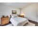 Bright bedroom with white walls, wood floors, and neutral decor that offers natural light at 2402 E 5Th St # 1742, Tempe, AZ 85288