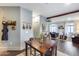 Charming dining area with wooden table, decor, and seamless flow to the inviting living room at 2402 E 5Th St # 1742, Tempe, AZ 85288