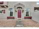 Home featuring a welcoming entrance with flower boxes and arched windows at 2402 E 5Th St # 1742, Tempe, AZ 85288