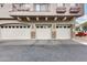 Three-car garage with traditional doors, offering ample parking and storage space in a well-maintained building at 2402 E 5Th St # 1742, Tempe, AZ 85288