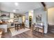 Open living area with dining, kitchen, wood floors, and natural light at 2402 E 5Th St # 1742, Tempe, AZ 85288
