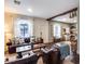 Comfortable living room with leather furniture, wood floors, and arched windows providing natural light at 2402 E 5Th St # 1742, Tempe, AZ 85288