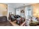 Bright and airy living room featuring leather furniture, large windows, and hardwood floors at 2402 E 5Th St # 1742, Tempe, AZ 85288