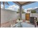 Inviting patio featuring decorative bistro set and low maintenance desert landscaping, perfect for relaxing outdoors at 2402 E 5Th St # 1742, Tempe, AZ 85288