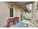 Serene covered patio with elegant bistro set and planter box, perfect for outdoor enjoyment at 2402 E 5Th St # 1742, Tempe, AZ 85288