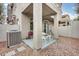 Private patio with concrete floor, stylish bistro set, and lush planter box, great for outdoor entertaining at 2402 E 5Th St # 1742, Tempe, AZ 85288