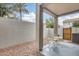 Cozy covered patio area with a quaint bistro set and a charming, low-maintenance desert landscape at 2402 E 5Th St # 1742, Tempe, AZ 85288