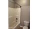 Clean bathroom featuring a shower/tub combo and a standard white toilet at 2486 E Espada Trl, Casa Grande, AZ 85194