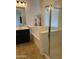 Bathroom showcasing a shower, bathtub, and a vanity with ample counter space at 2486 E Espada Trl, Casa Grande, AZ 85194