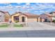 Charming single story home with well-manicured lawn and a two-car garage at 2486 E Espada Trl, Casa Grande, AZ 85194