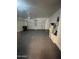 A clean and spacious garage featuring epoxy flooring, a garage door opener, and a water heater at 2486 E Espada Trl, Casa Grande, AZ 85194