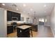 Updated kitchen with stainless steel appliances, island, and ample counter space at 2486 E Espada Trl, Casa Grande, AZ 85194