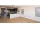 Open-concept kitchen with breakfast bar and stainless-steel appliances, flowing into the living area at 2486 E Espada Trl, Casa Grande, AZ 85194
