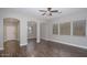 Bright living room featuring hardwood floors, light neutral walls, and ample natural light at 2486 E Espada Trl, Casa Grande, AZ 85194