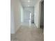 Bright entryway with tile flooring leading to open living spaces and stairway at 25330 W Bowker St, Buckeye, AZ 85326