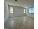 Bright and airy living room with tile flooring and natural light streaming through the windows at 25330 W Bowker St, Buckeye, AZ 85326