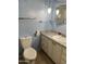 Cozy bathroom featuring a granite countertop, hanging lights, and a toilet at 2605 W Rose Ln # B101, Phoenix, AZ 85017