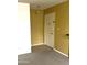 A well-lit entryway featuring neutral walls, tile flooring, and an entry door with a peephole at 2605 W Rose Ln # B101, Phoenix, AZ 85017