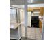Functional kitchen layout with wood cabinets, black appliances, and an open view to the living area at 2605 W Rose Ln # B101, Phoenix, AZ 85017